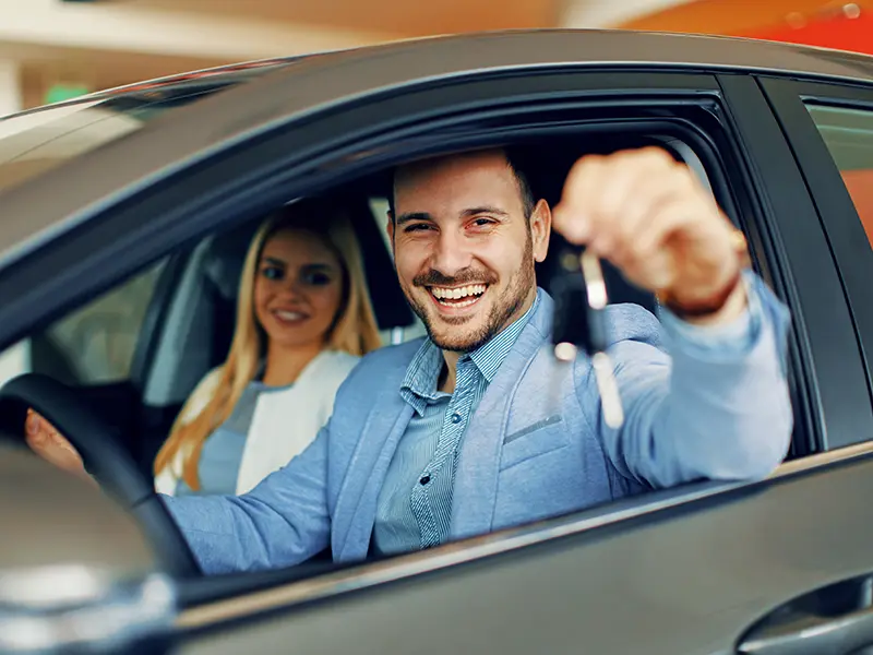 man in new car